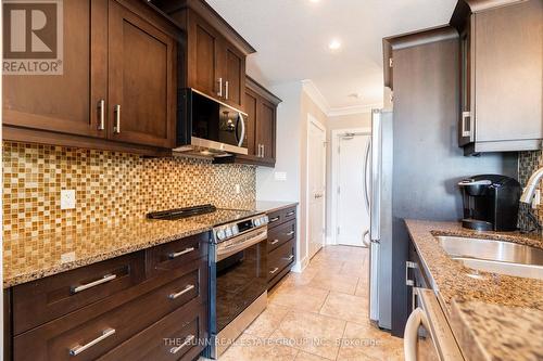 405 - 340 Sugarcreek Trail, London, ON - Indoor Photo Showing Kitchen With Double Sink