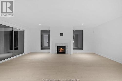 4557 Valerio Crescent, Lasalle, ON - Indoor Photo Showing Other Room With Fireplace