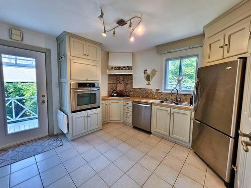 Cuisine - 445 Rue Thomas, Lachute, QC - Indoor Photo Showing Kitchen With Double Sink