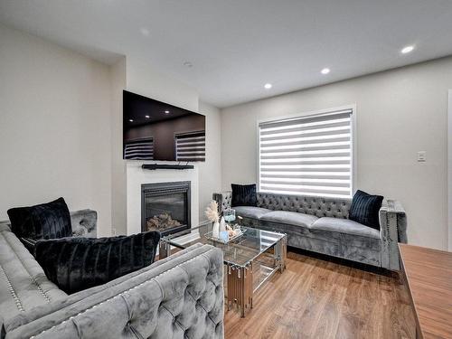 Salon - 204 Rue Mactier, Mascouche, QC - Indoor Photo Showing Living Room With Fireplace