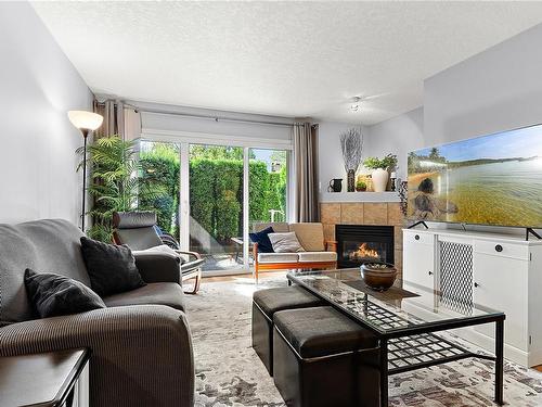 101-1240 Verdier Ave, Central Saanich, BC - Indoor Photo Showing Living Room With Fireplace