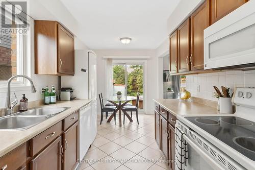 Watch the dogs and kids play in the backyard - 168 Emerald Road, London, ON - Indoor Photo Showing Kitchen With Double Sink