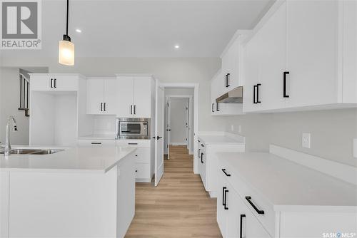 348 Leskiw Bend, Saskatoon, SK - Indoor Photo Showing Kitchen With Double Sink