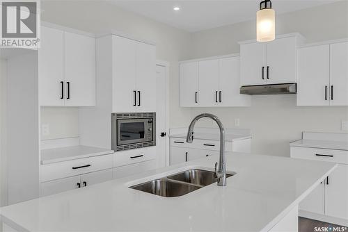 348 Leskiw Bend, Saskatoon, SK - Indoor Photo Showing Kitchen With Double Sink