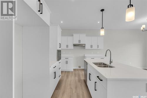 348 Leskiw Bend, Saskatoon, SK - Indoor Photo Showing Kitchen With Double Sink