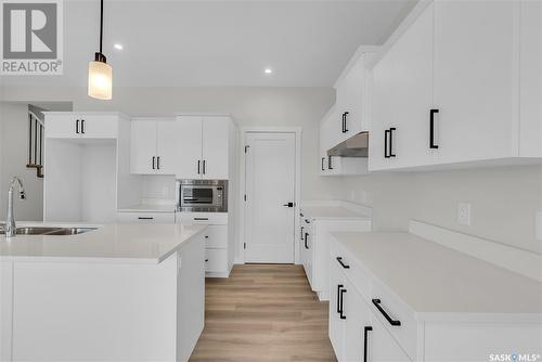 348 Leskiw Bend, Saskatoon, SK - Indoor Photo Showing Kitchen With Double Sink