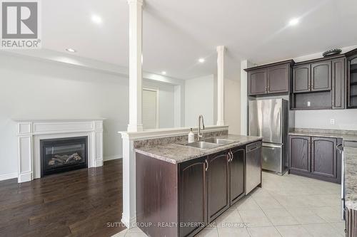 6 Dufay Road, Brampton, ON - Indoor Photo Showing Kitchen With Fireplace With Double Sink