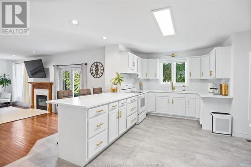 599 Sacred Heart, Lasalle, ON - Indoor Photo Showing Kitchen With Fireplace