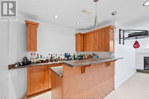 599 Sacred Heart, Lasalle, ON - Indoor Photo Showing Kitchen With Fireplace