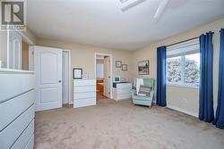 Primary bedroom view of ensuite & walk in closet. - 