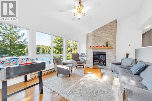 1018C Leisure Lane, North Frontenac, ON - Indoor Photo Showing Living Room With Fireplace