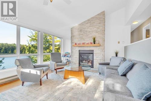 1018C Leisure Lane, North Frontenac, ON - Indoor Photo Showing Living Room With Fireplace