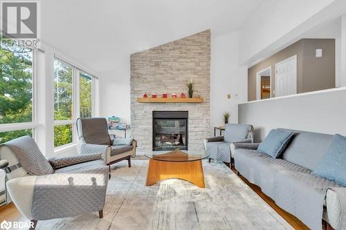 1018C Leisure Ln, Cloyne, ON - Indoor Photo Showing Living Room With Fireplace