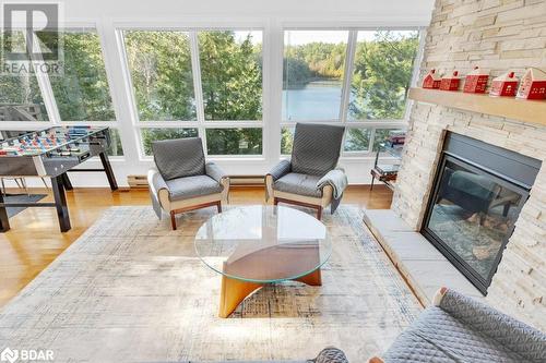 1018C Leisure Ln, Cloyne, ON - Indoor Photo Showing Living Room With Fireplace