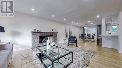 23 Quincy Crescent, Toronto, ON - Indoor Photo Showing Living Room With Fireplace