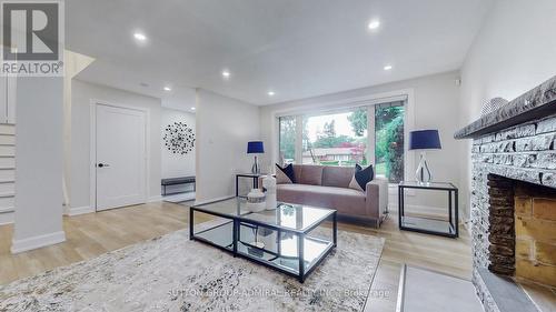 23 Quincy Crescent, Toronto, ON - Indoor Photo Showing Living Room With Fireplace