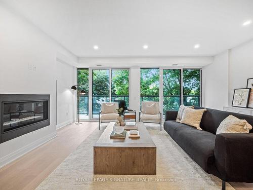 304-285 Avenue Rd, Toronto, ON - Indoor Photo Showing Living Room With Fireplace