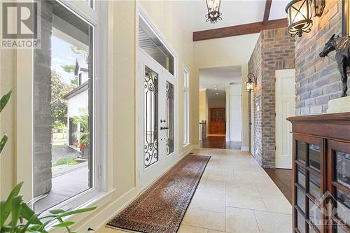 This property boast luxurious finishes and meticulous architectural details throughout, starting with the grand tiled foyer. - 165 Adrien Street, Clarence-Rockland, ON - Indoor Photo Showing Other Room With Fireplace