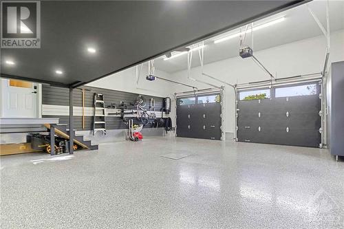 The oversized heated garage provides ample space for a workshop and additional ‘loft’ storage, making it a true man-cave. - 165 Adrien Street, Clarence-Rockland, ON - Indoor Photo Showing Garage