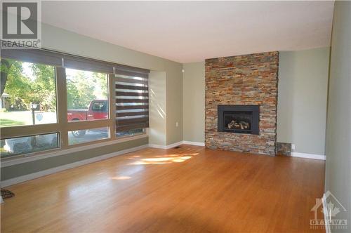 5 Whitburn Crescent, Ottawa, ON - Indoor Photo Showing Living Room With Fireplace