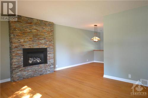 5 Whitburn Crescent, Ottawa, ON - Indoor Photo Showing Living Room With Fireplace