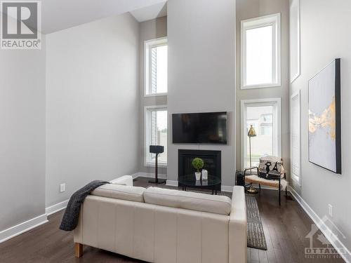 4945 Abbott Street E, Ottawa, ON - Indoor Photo Showing Living Room With Fireplace