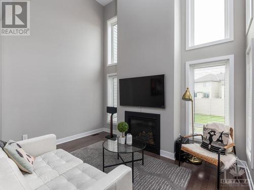 4945 Abbott Street E, Ottawa, ON - Indoor Photo Showing Living Room With Fireplace