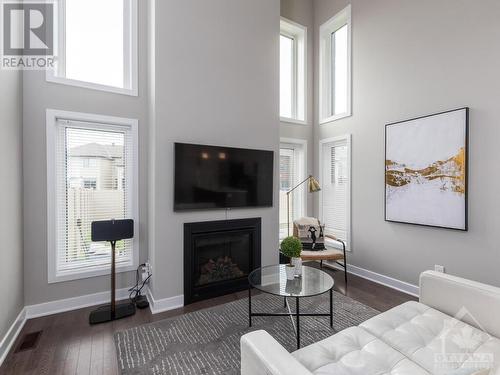 4945 Abbott Street E, Ottawa, ON - Indoor Photo Showing Living Room With Fireplace