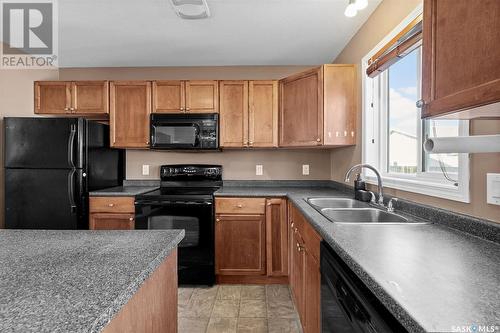 487 Blakeney Crescent, Saskatoon, SK - Indoor Photo Showing Kitchen With Double Sink