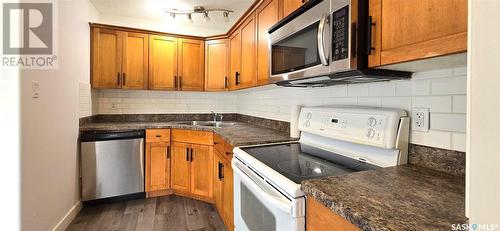 #1 1507 19Th Street W, Saskatoon, SK - Indoor Photo Showing Kitchen With Double Sink