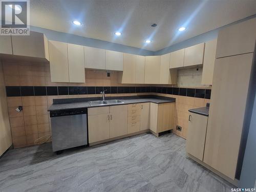 2152 Deans Crescent, North Battleford, SK - Indoor Photo Showing Kitchen With Double Sink