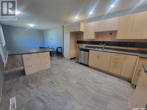 2152 Deans Crescent, North Battleford, SK - Indoor Photo Showing Kitchen With Double Sink