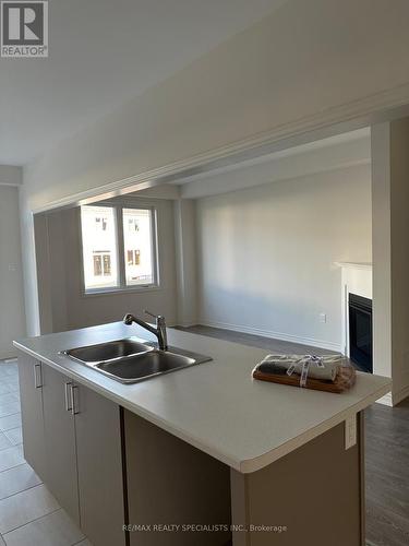 73 Prest Way, Centre Wellington, ON - Indoor Photo Showing Kitchen With Double Sink