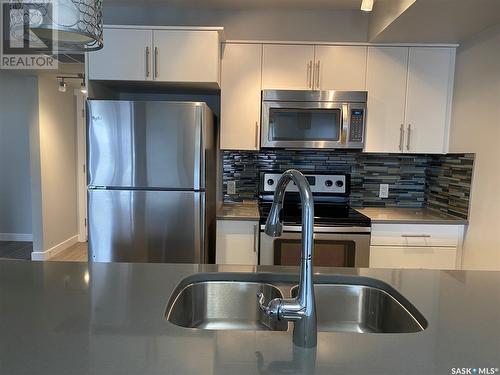 207 5301 Universal Crescent, Regina, SK - Indoor Photo Showing Kitchen With Stainless Steel Kitchen With Double Sink