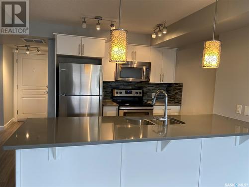 207 5301 Universal Crescent, Regina, SK - Indoor Photo Showing Kitchen With Stainless Steel Kitchen With Double Sink