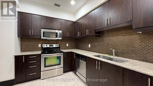 Lph09 - 55 De Boers Drive, Toronto, ON - Indoor Photo Showing Kitchen With Double Sink With Upgraded Kitchen