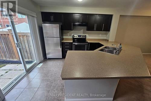 1008 Timmer Place, Milton, ON - Indoor Photo Showing Kitchen With Double Sink