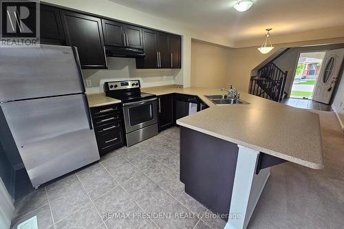 1008 Timmer Place, Milton, ON - Indoor Photo Showing Kitchen With Double Sink