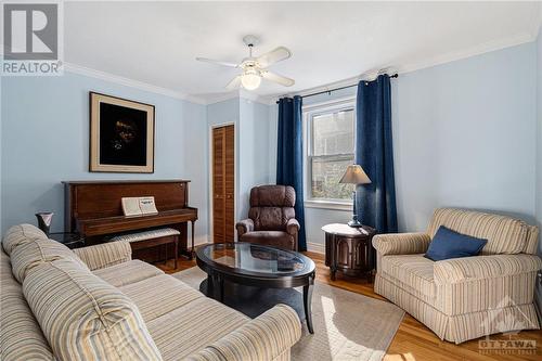 Bright formal living room with strip hardwood floors. - 526 Mutual Street, Ottawa, ON - Indoor Photo Showing Living Room