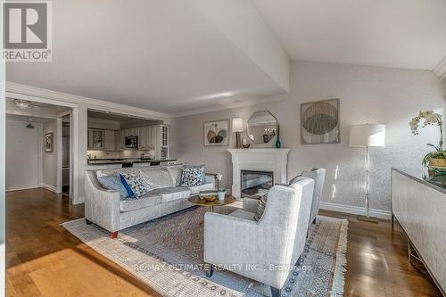 523 - 40 Sylvan Valleyway, Toronto, ON - Indoor Photo Showing Living Room With Fireplace