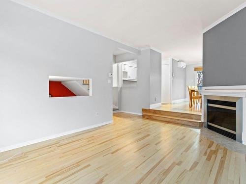 Living room - 3480 Rue Arthur-Généreux, Montréal (Rivière-Des-Prairies/Pointe-Aux-Trembles), QC - Indoor Photo Showing Living Room With Fireplace