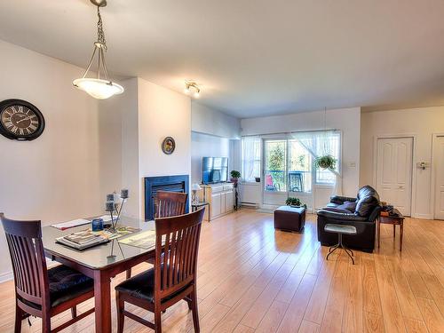 Dining room - 63-12585 Rue Forsyth, Montréal (Rivière-Des-Prairies/Pointe-Aux-Trembles), QC - Indoor Photo Showing Other Room With Fireplace