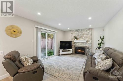 1010 Cahill Drive W, Ottawa, ON - Indoor Photo Showing Living Room With Fireplace