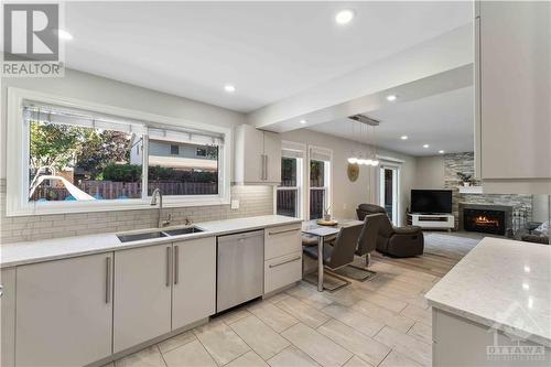 1010 Cahill Drive W, Ottawa, ON - Indoor Photo Showing Kitchen With Fireplace With Double Sink