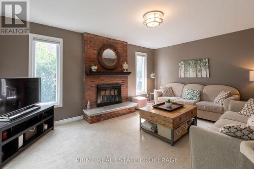 64 Walmer Gardens, London, ON - Indoor Photo Showing Living Room With Fireplace