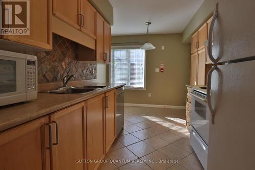 2 - 704 Neighbourhood Circle, Mississauga, ON - Indoor Photo Showing Kitchen With Double Sink