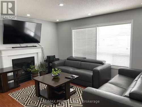 16 Tawnie Crescent, Brampton, ON - Indoor Photo Showing Living Room With Fireplace