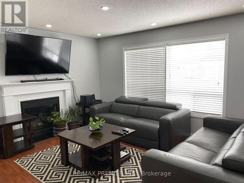 Upper - 16 Tawnie Crescent, Brampton, ON - Indoor Photo Showing Living Room With Fireplace