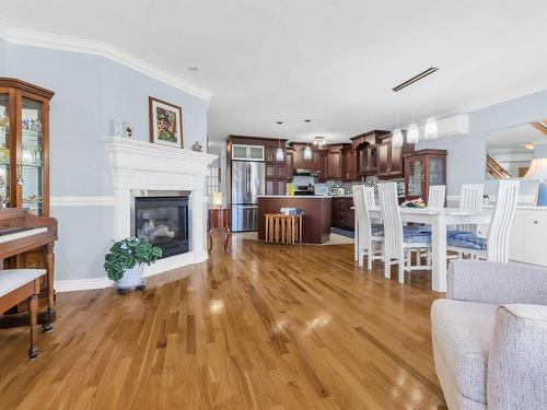 Vue d'ensemble - 202-1334A Rue Notre-Dame, Repentigny (Repentigny), QC - Indoor Photo Showing Living Room With Fireplace