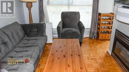 311 332 Lonsdale Avenue, North Vancouver, BC - Indoor Photo Showing Living Room With Fireplace